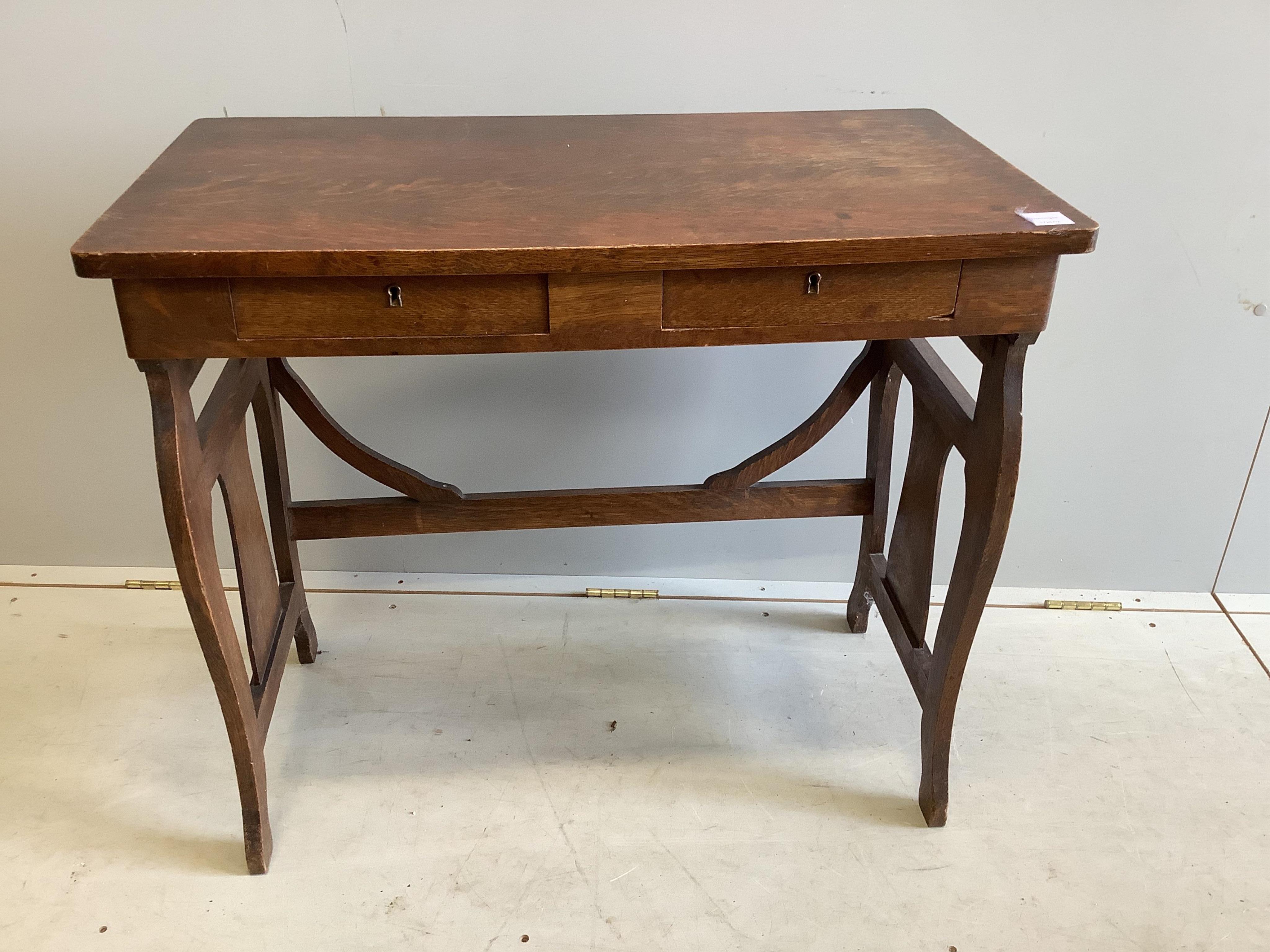 An early 20th century Continental oak two drawer side table, width 82cm, depth 44cm, height 72cm. Condition - fair